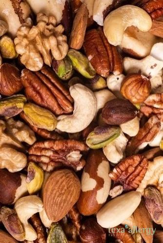 Various nuts, refering to a Nut Allergy, with Texa Logo in the bottom right corner.